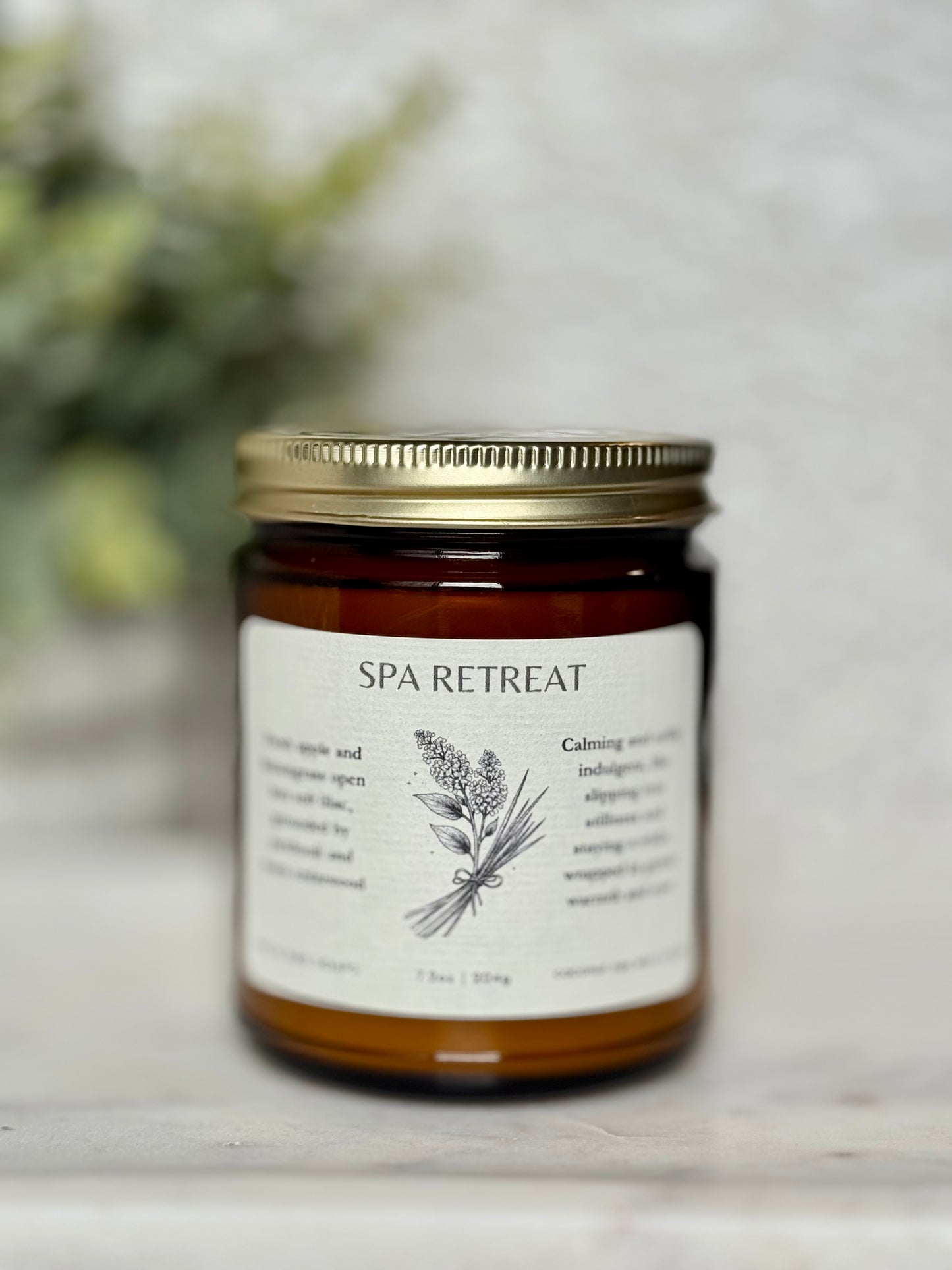 Jar of 'Spa Retreat' candle on a light background