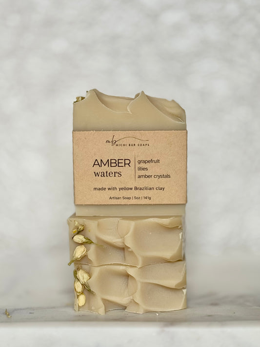 Bar of soap with a brown label on a light gray background