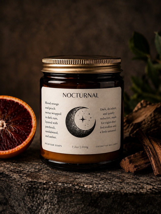 glass amber jar candle with a gold lid