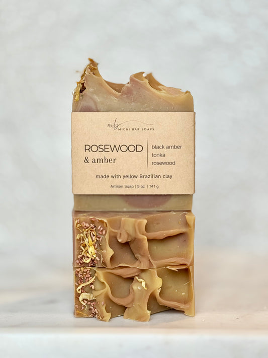 Bar of soap with a visible brand label on a light gray background