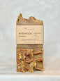 Bar of soap with a visible brand label on a light gray background